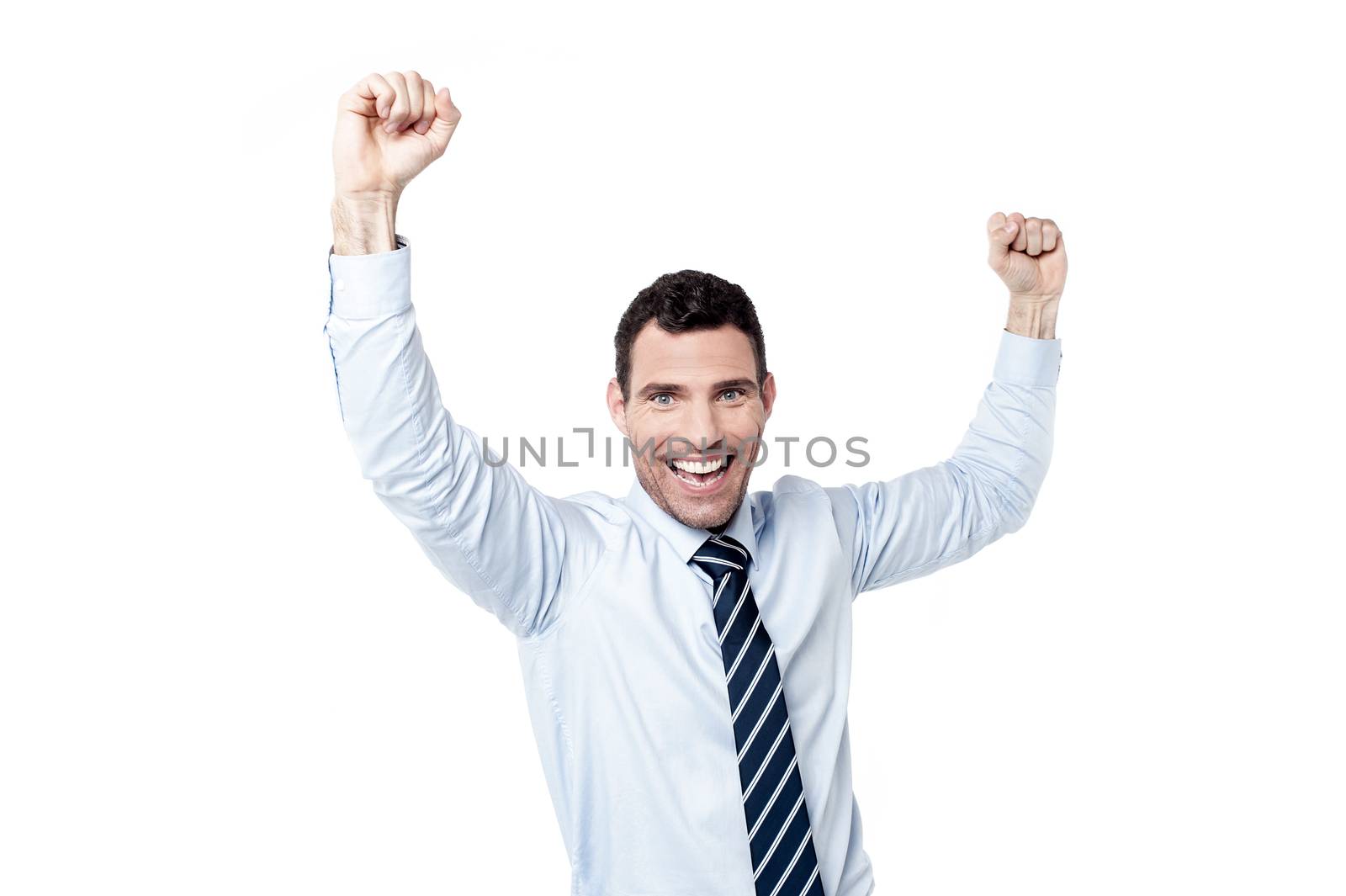 Successful businessman with raising hands