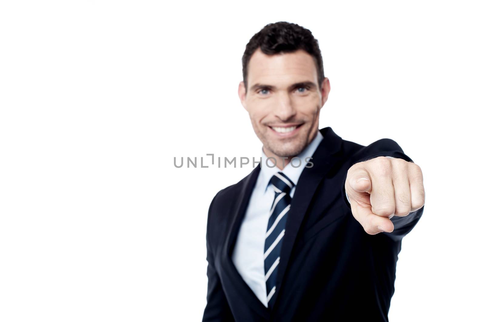 Businessman pointing his finger at camera