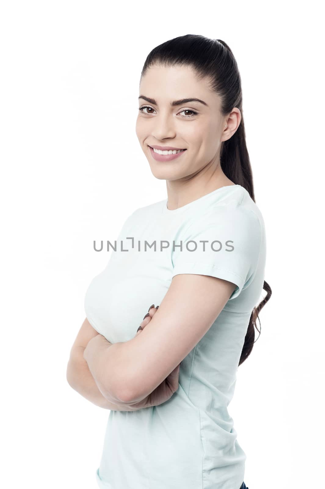 Side pose young woman posing with folded arms