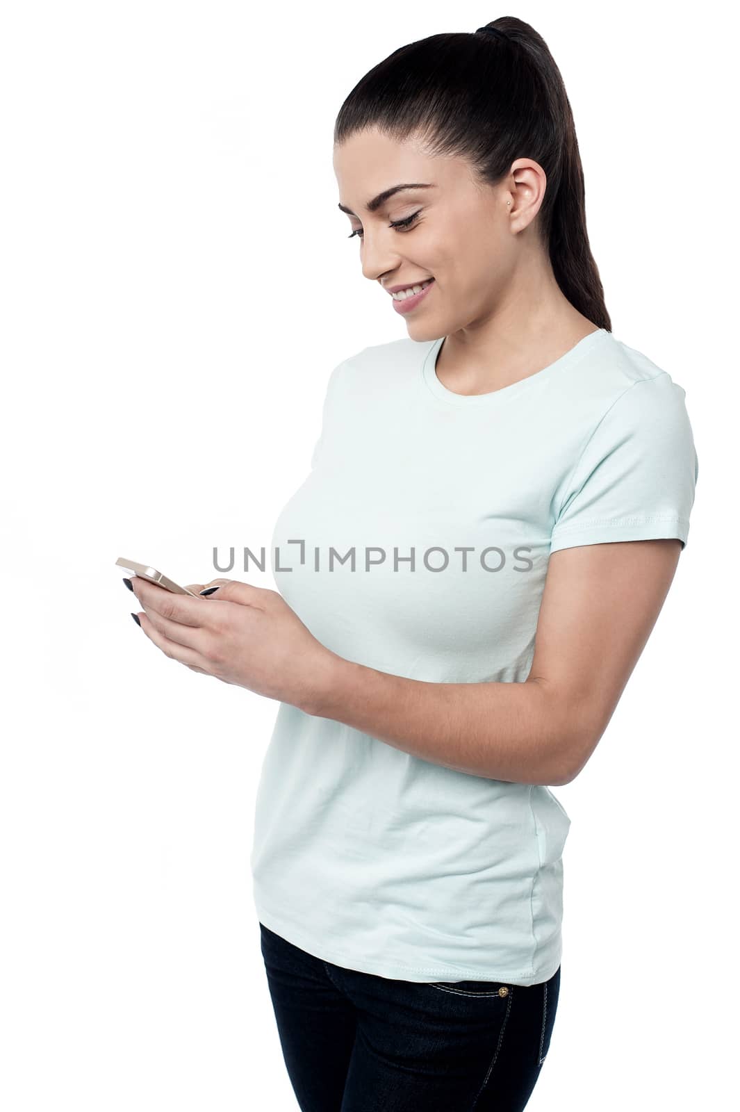Woman interestingly operating her cell phone