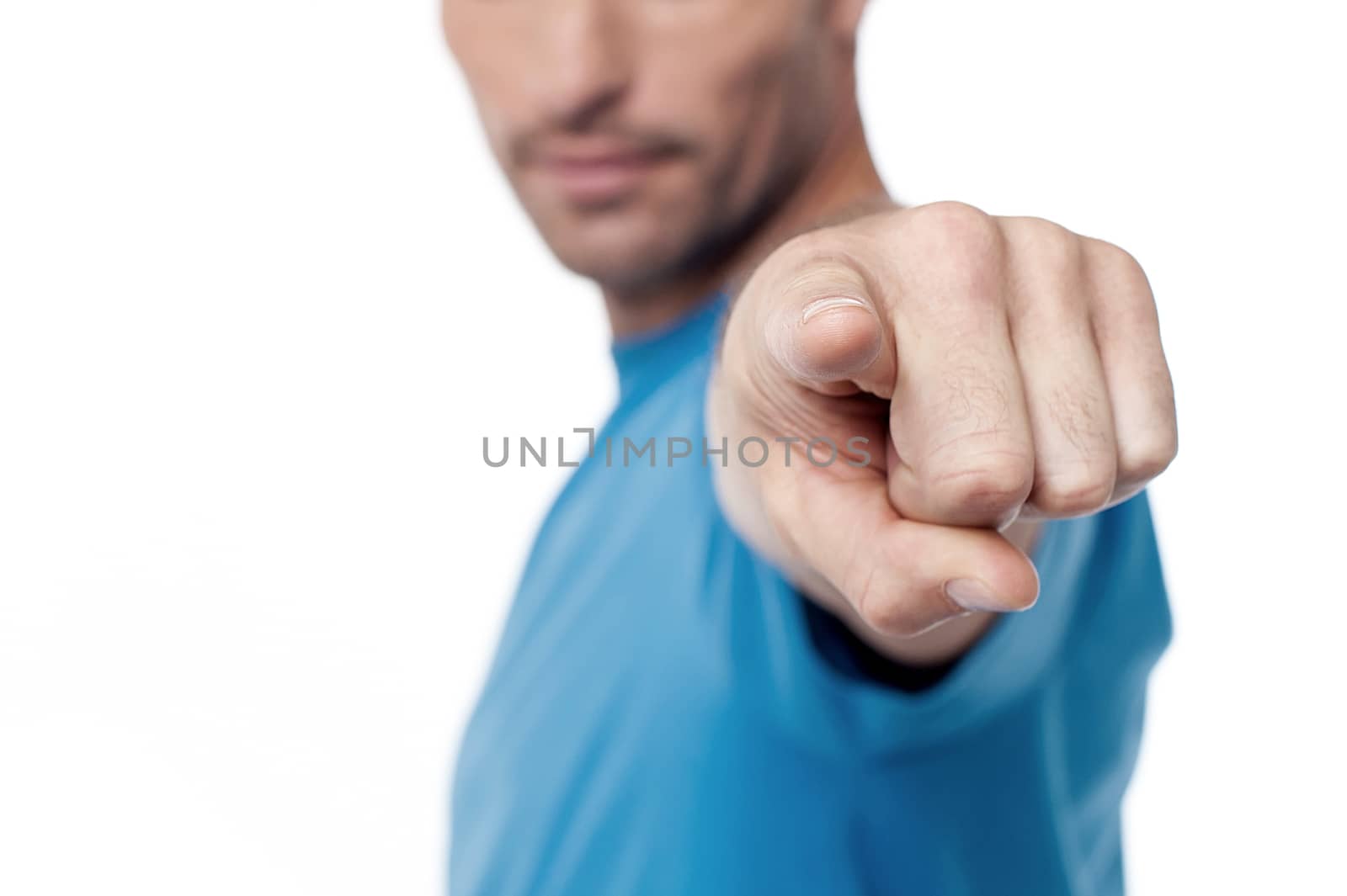 Casual man pointing to camera, cropped image.