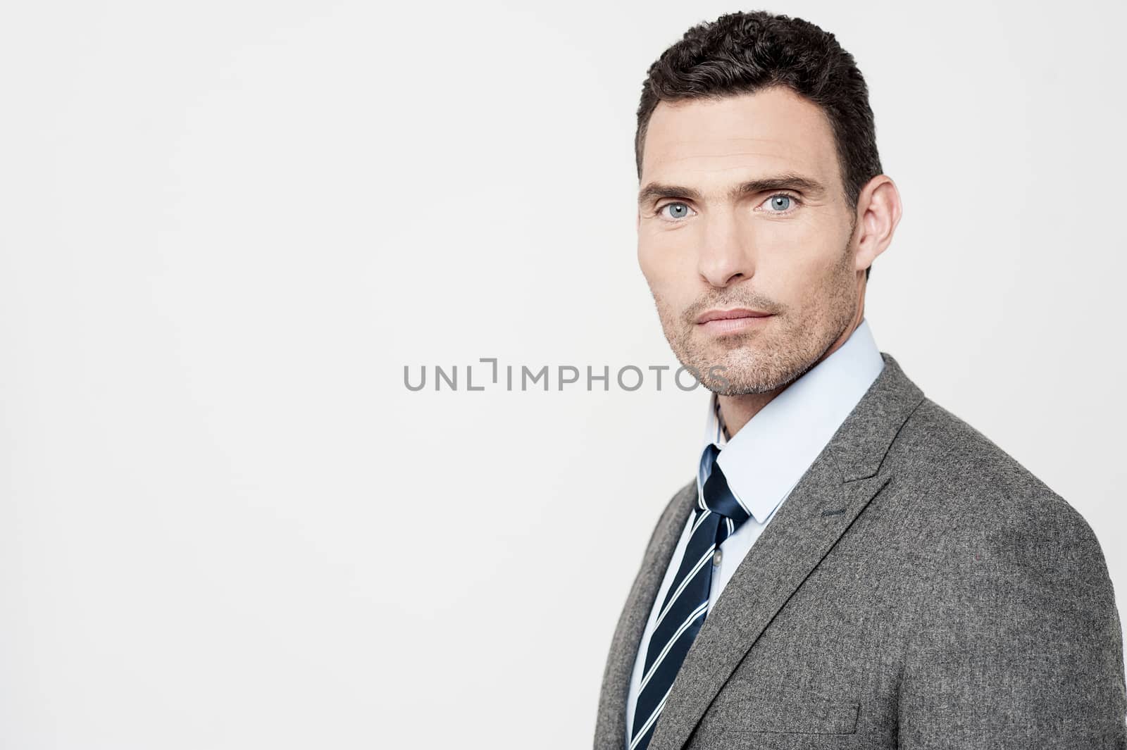 Side pose of experienced businessman posing to camera