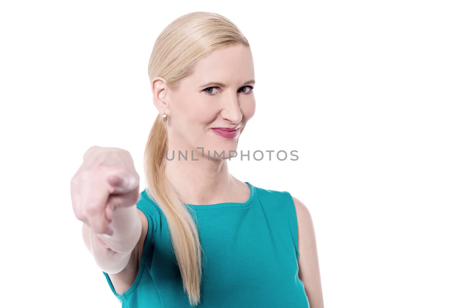 Middle aged woman pointing towards to camera