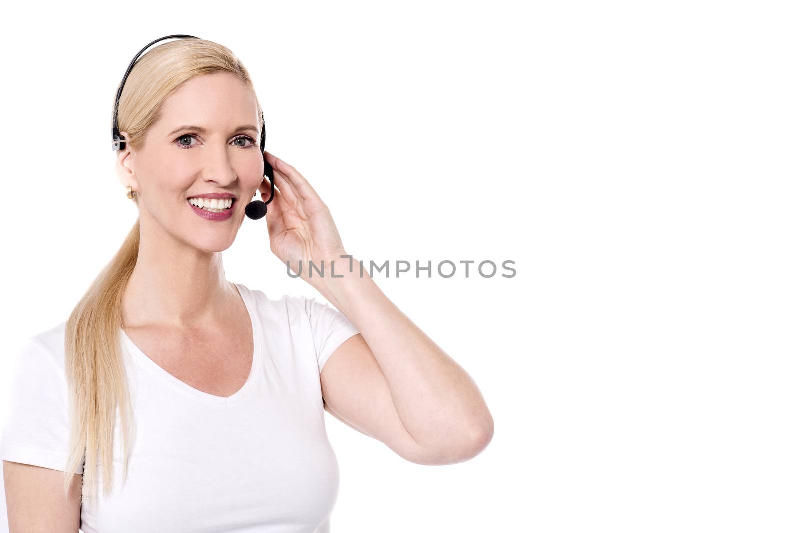Happy female call center staff with ear phones
