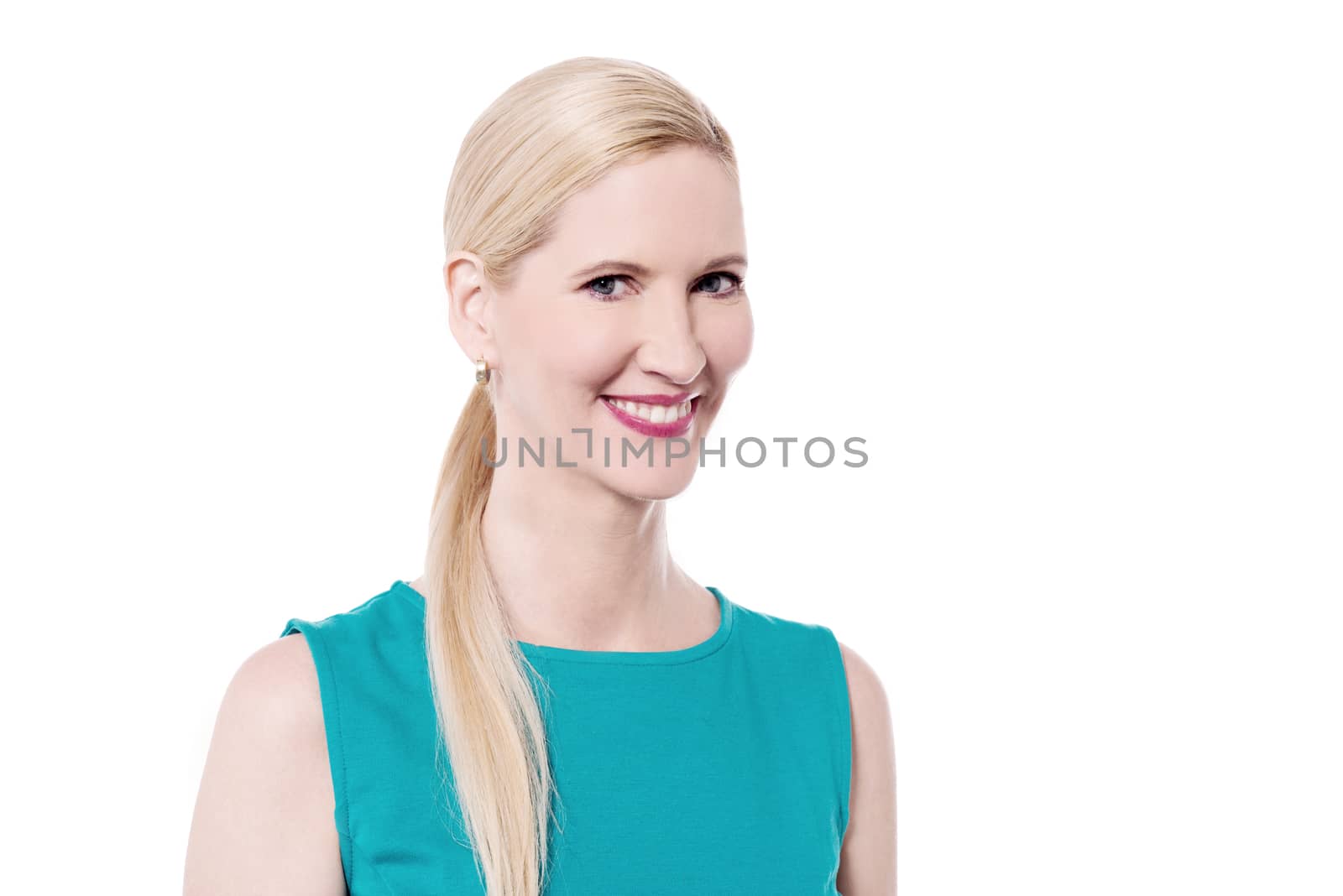 Smiling woman looking at camera by stockyimages