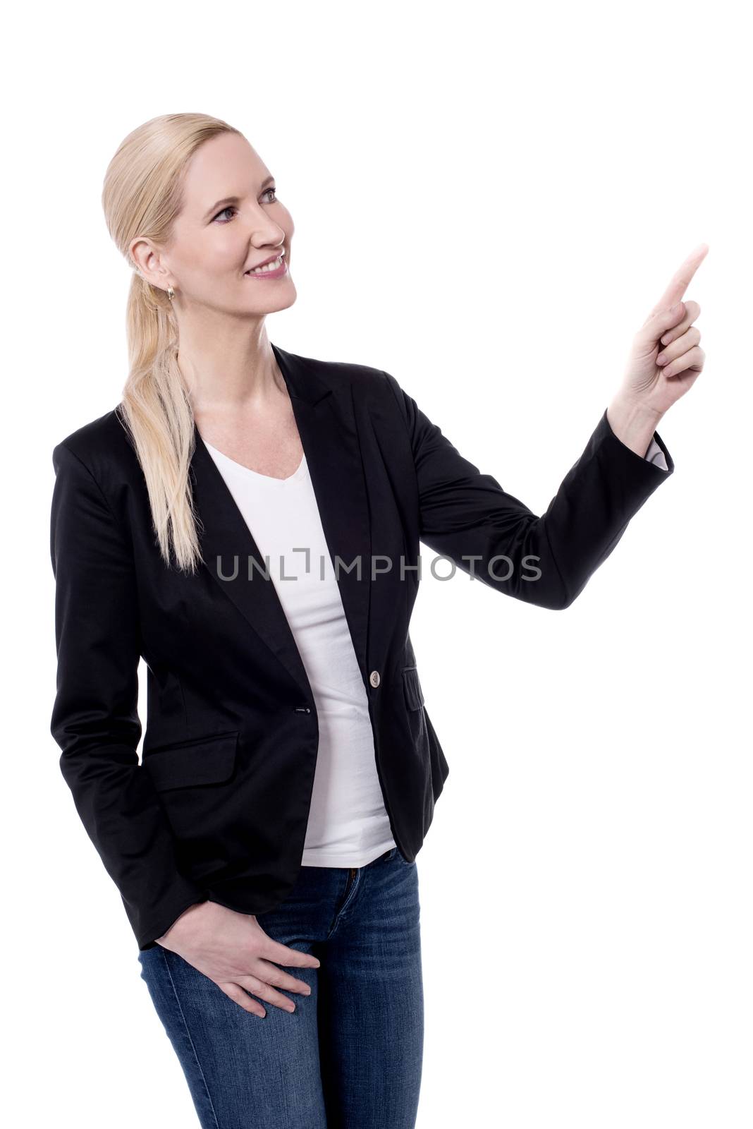 Happy business woman pointing at copyspace