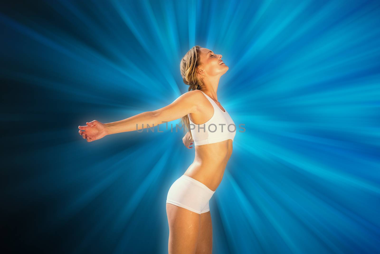 Composite image of gorgeous fit blonde standing with arms out by Wavebreakmedia