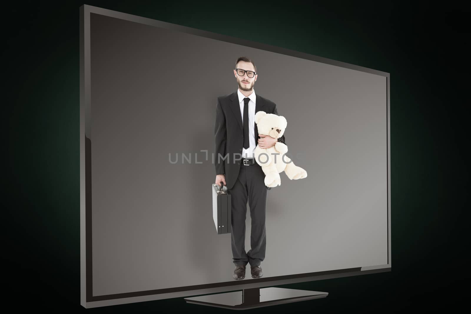 Geeky businessman holding briefcase and teddy against green background with vignette