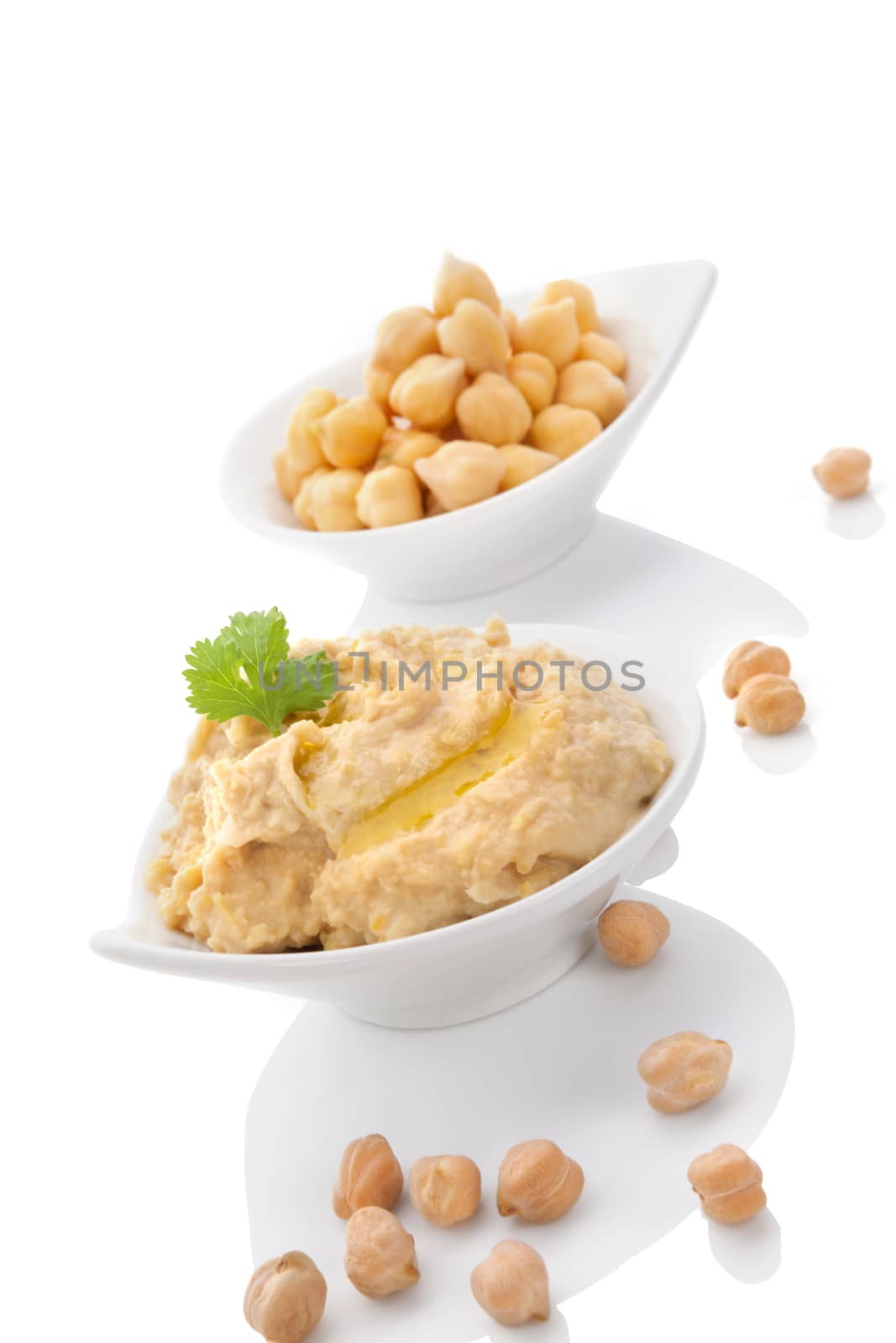 Chickpeas and hummus in bowls isolated on white background. Culinary eastern cuisine. 