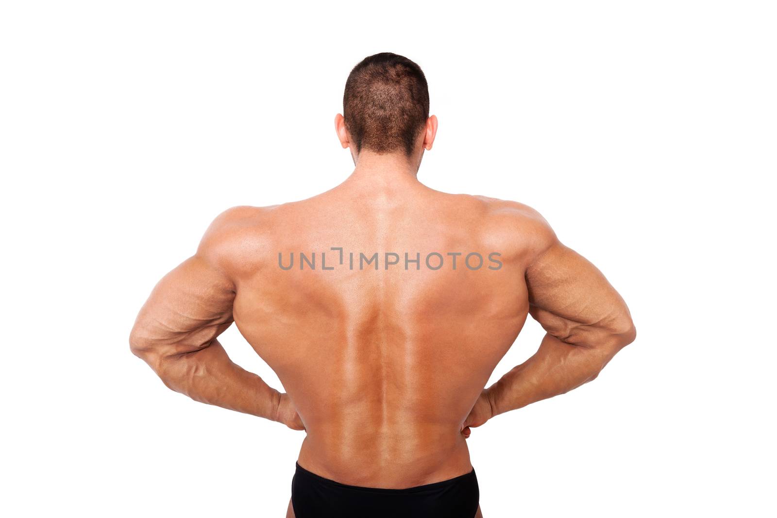 Huge bodybuilder back on steroids. Bodybuilder posing isolated on white background. 