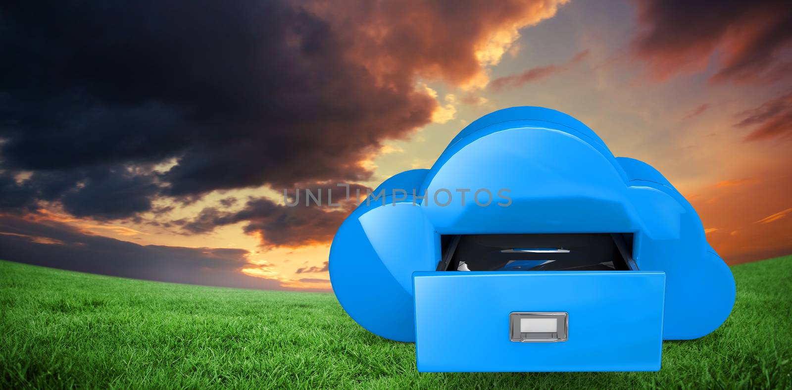 Cloud computing drawer against green field under orange sky