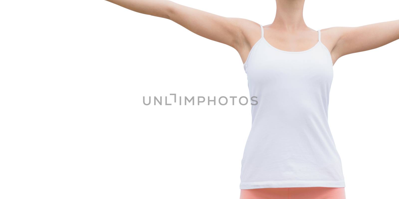 Beautiful woman with arms raised against the sky