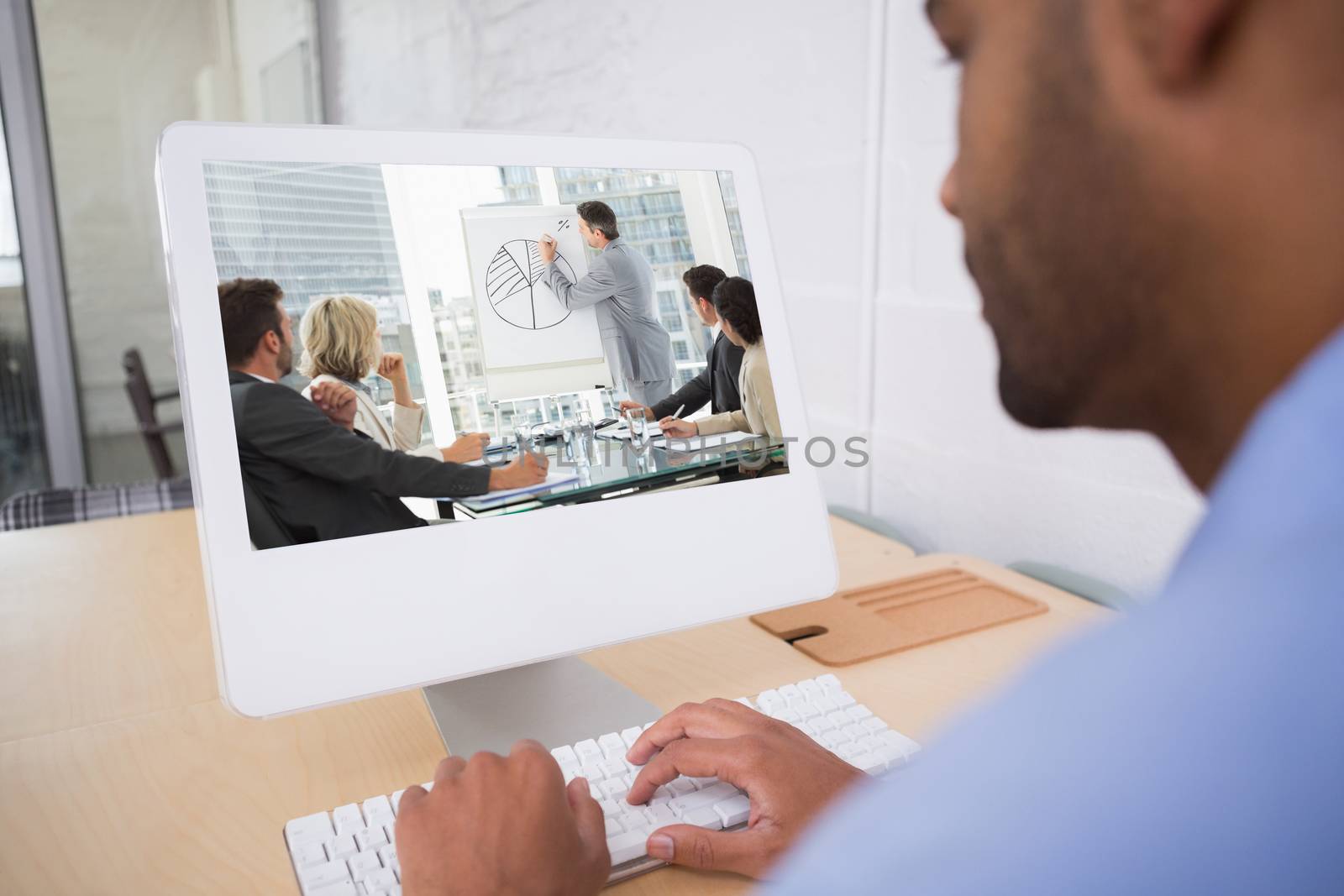 Composite image of business people in office at presentation by Wavebreakmedia