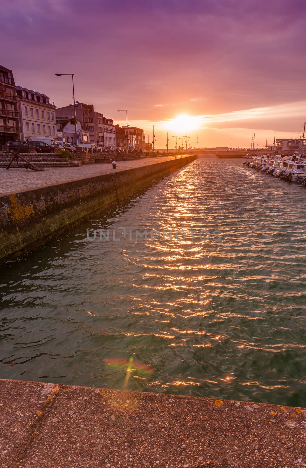 FECAMP, FRANCE - JUNE 12, 2014: City skyline at sunset. The town by jovannig