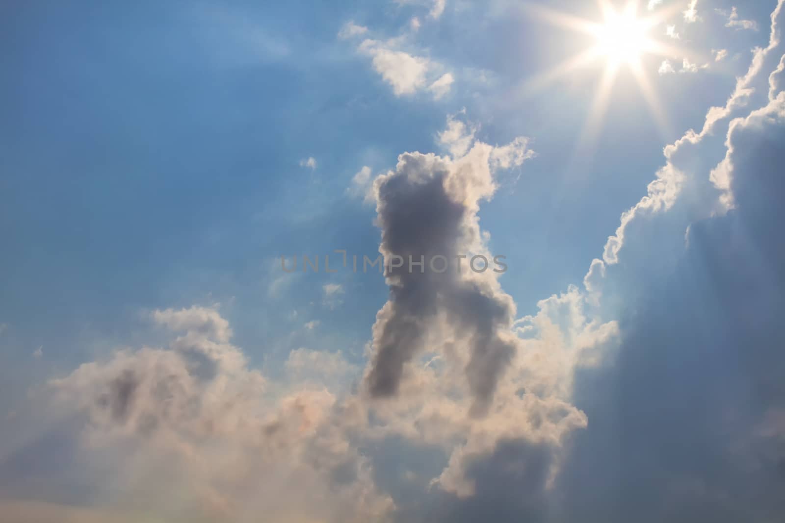 Sun and clouds on sky background