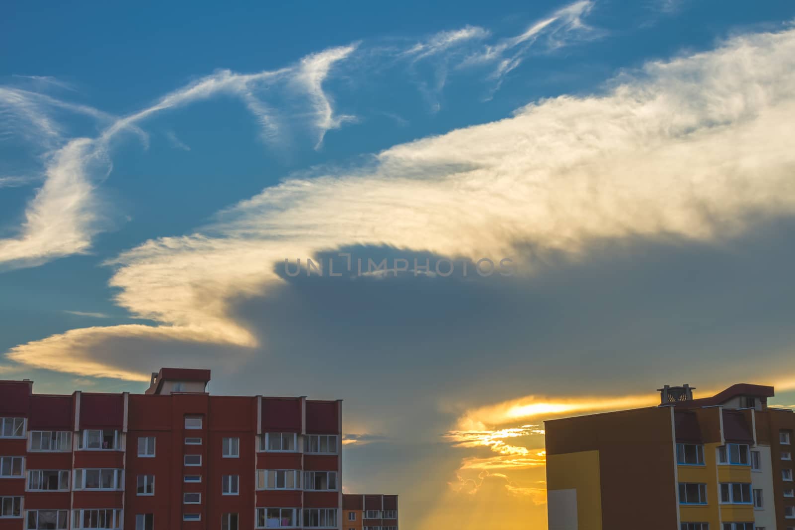 Clouds on blue sky background at sunset