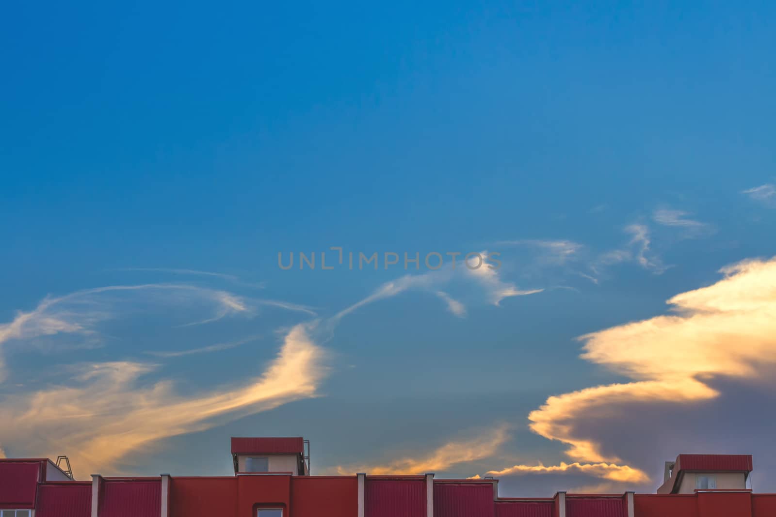 Clouds on blue sky background at sunset