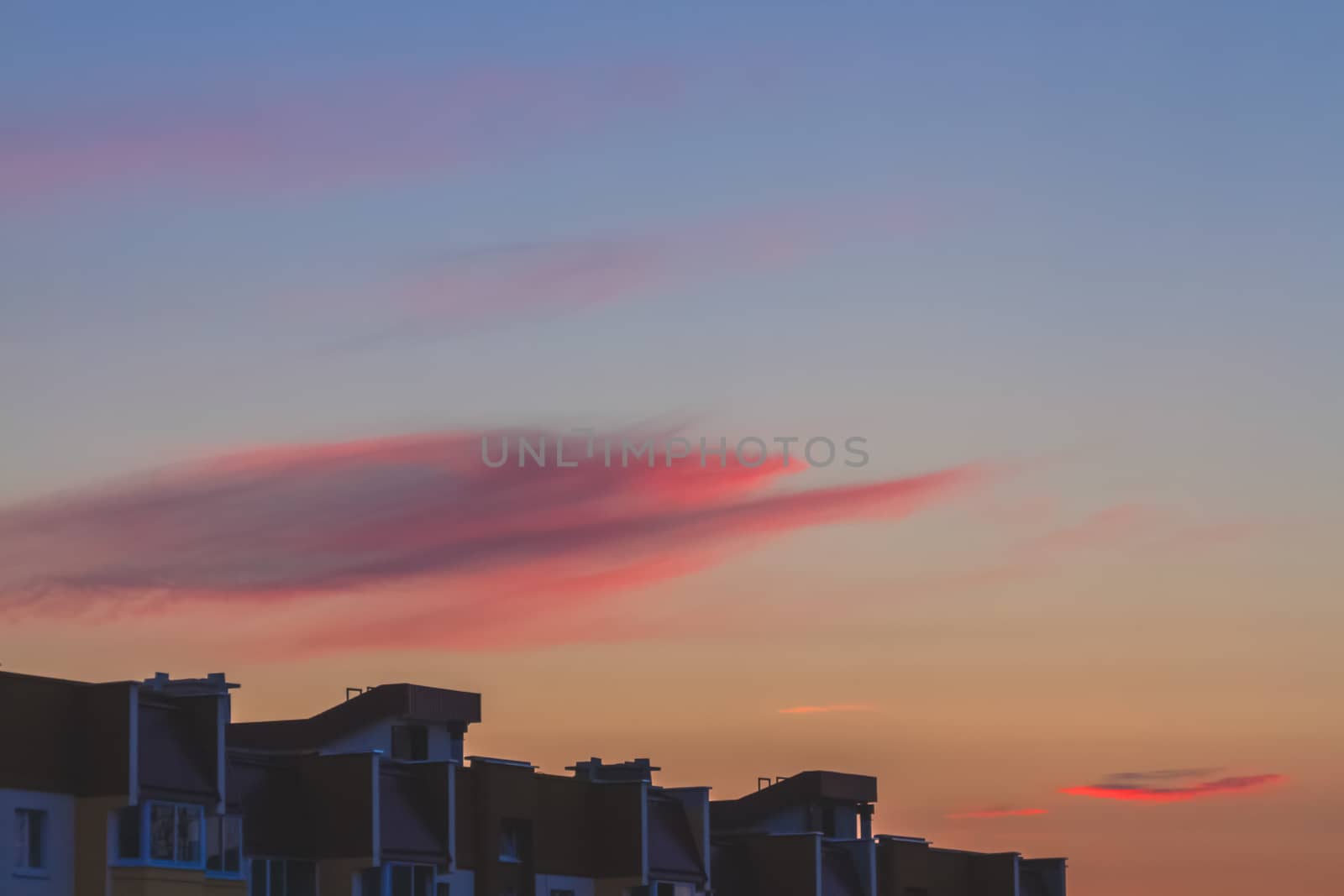 Clouds on sky background at sunset