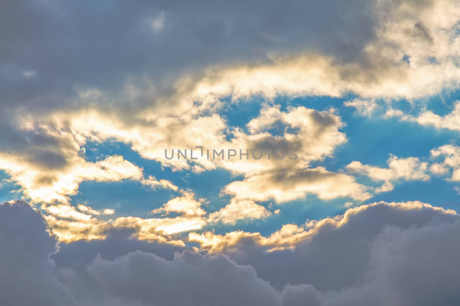 Clouds at sunset on sky background
