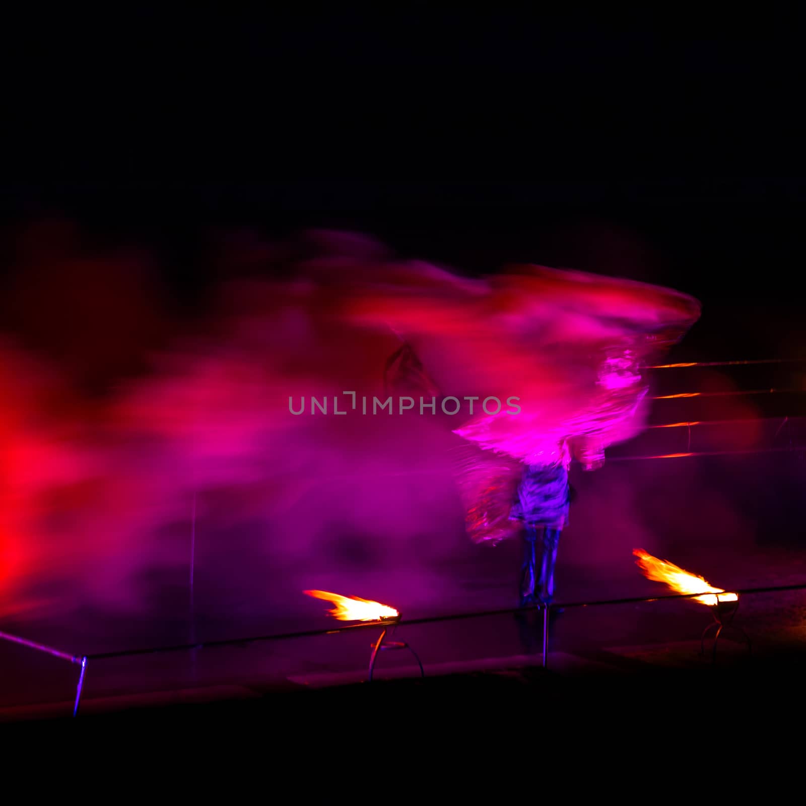 Smoke performer in motion at night