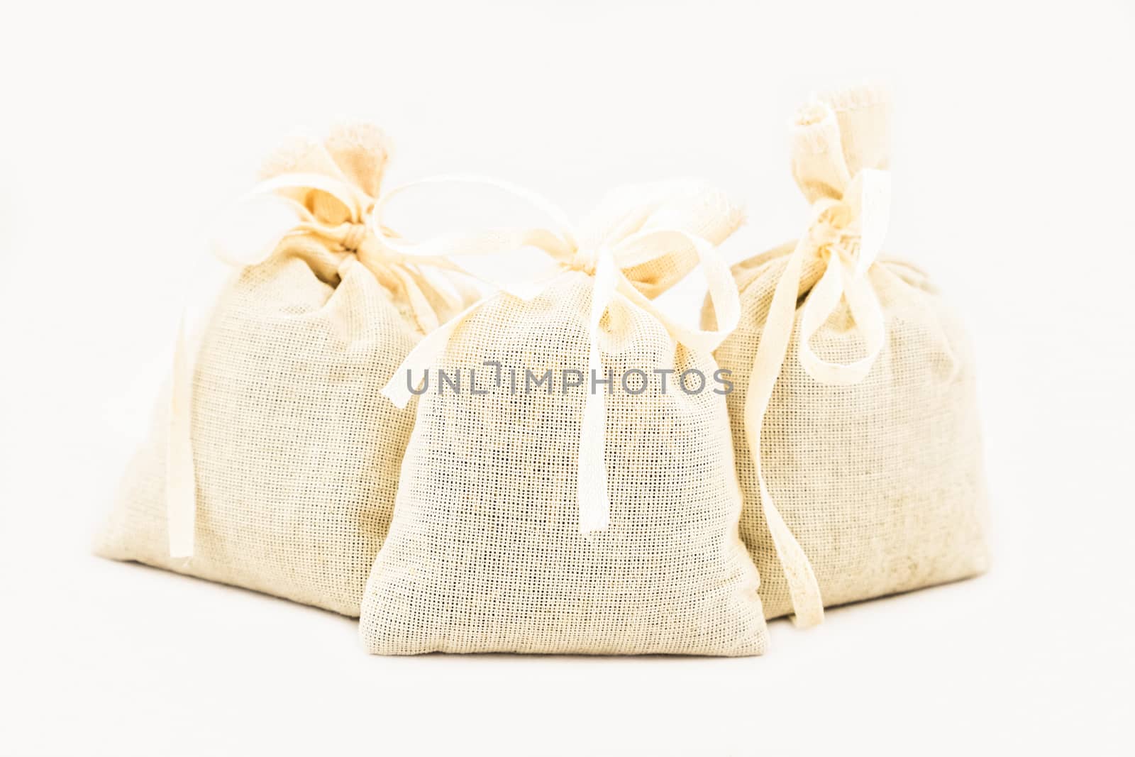 Textile sachet pouches on white background