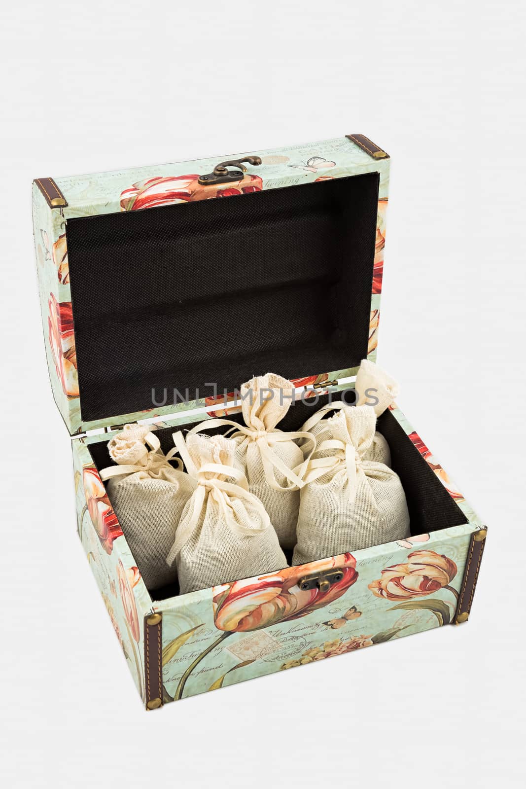 Gift box with textile pouches on white background