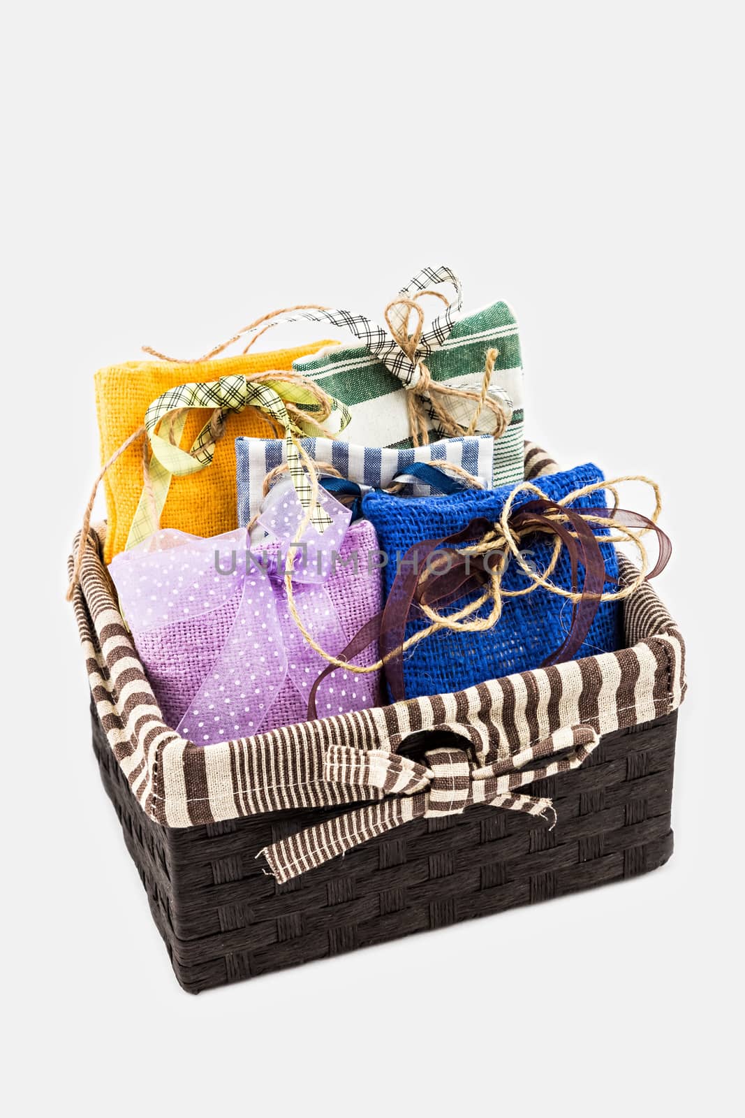 Decorative textile sachet pouches in gift box on white background