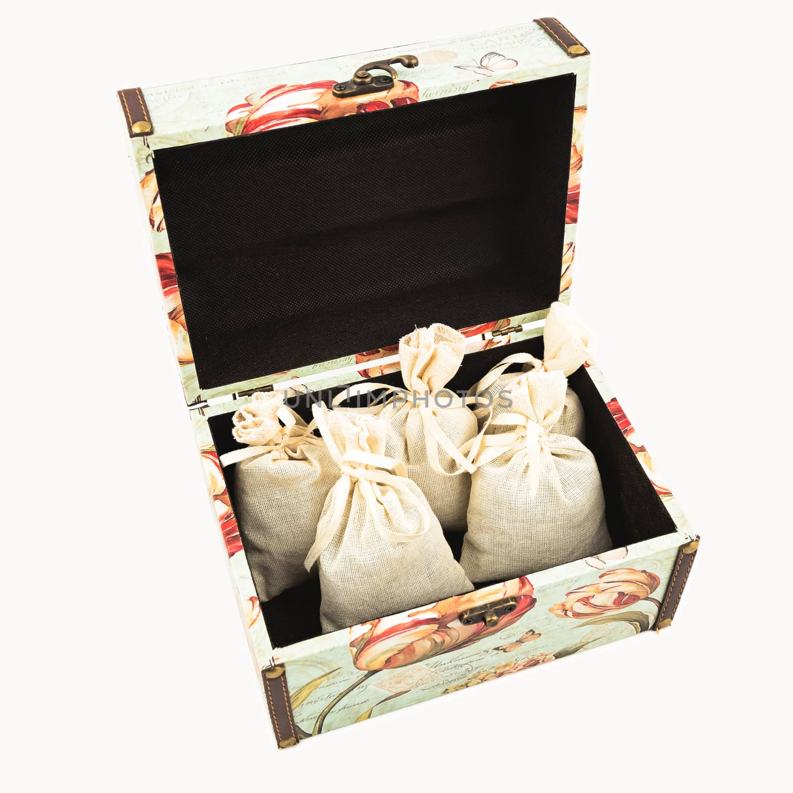 Gift box with textile pouches on white background