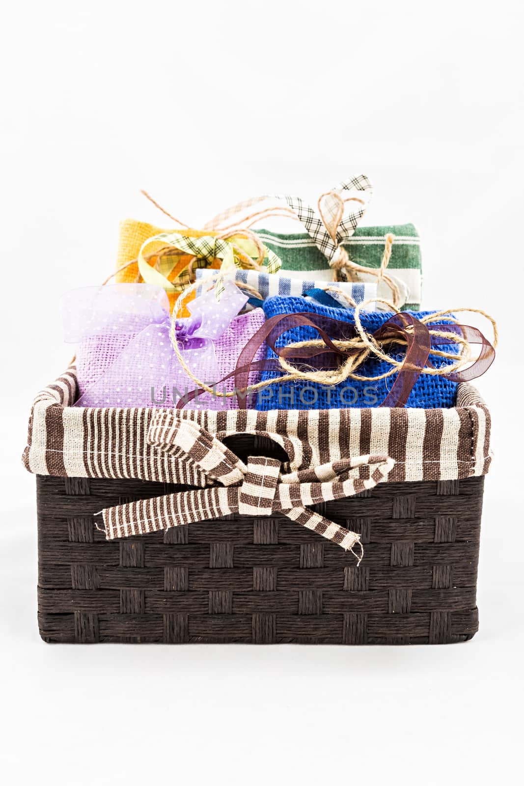 Decorative textile sachet pouches in gift box on white background