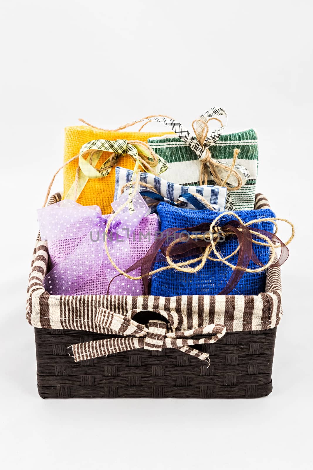 Decorative textile sachet pouches in gift box on white background