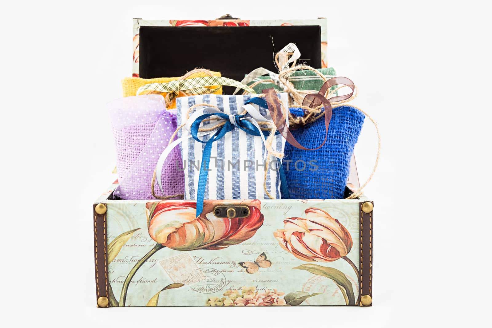 Decorative textile sachet pouches in gift box on white background