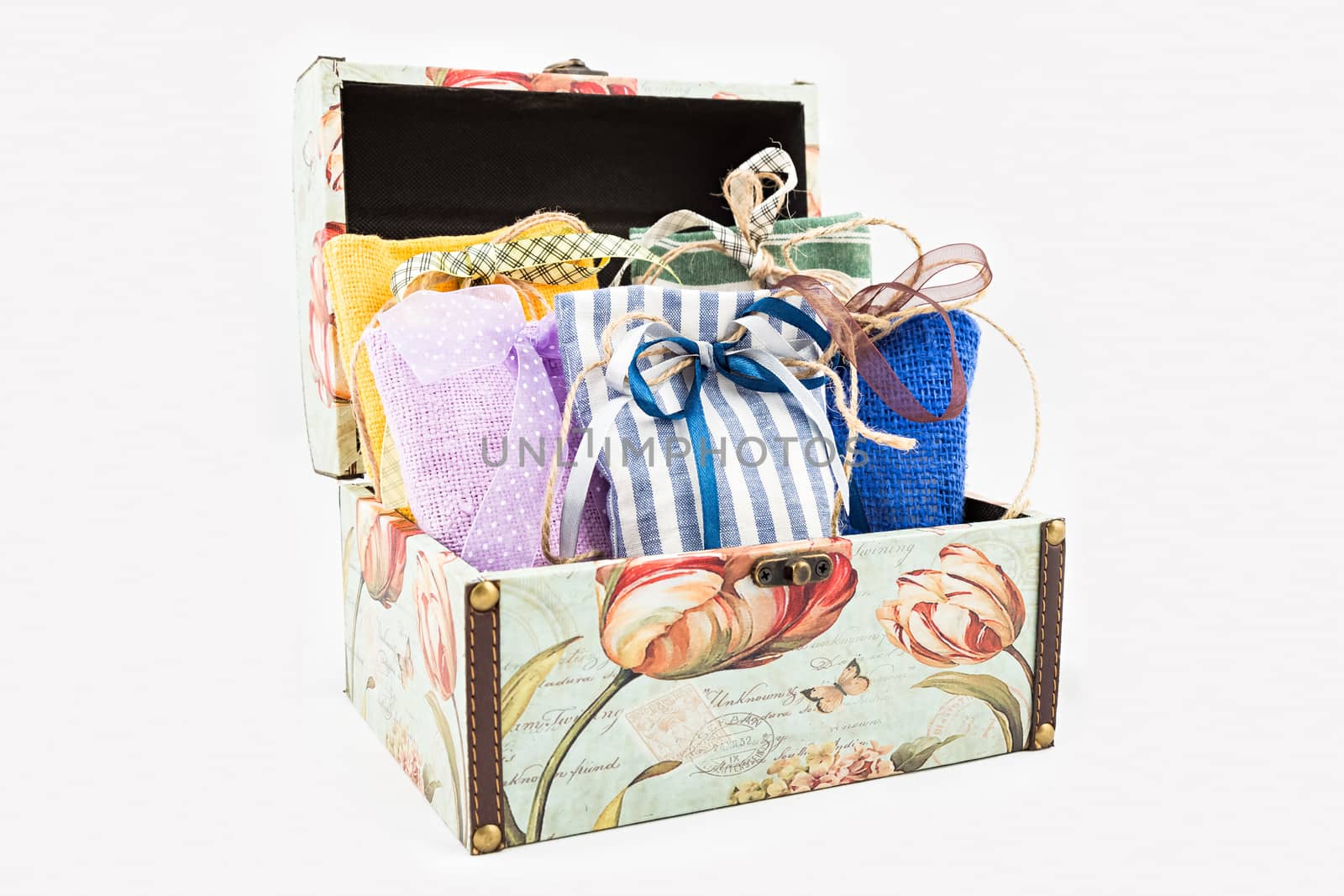 Decorative textile sachet pouches in gift box on white background