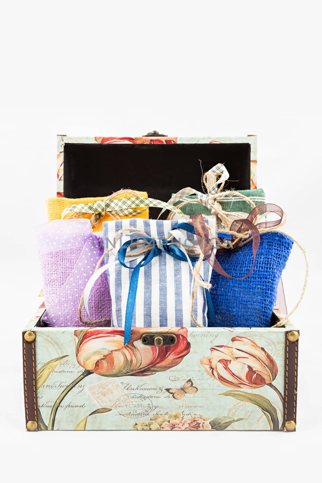 Decorative textile sachet pouches in gift box on white background