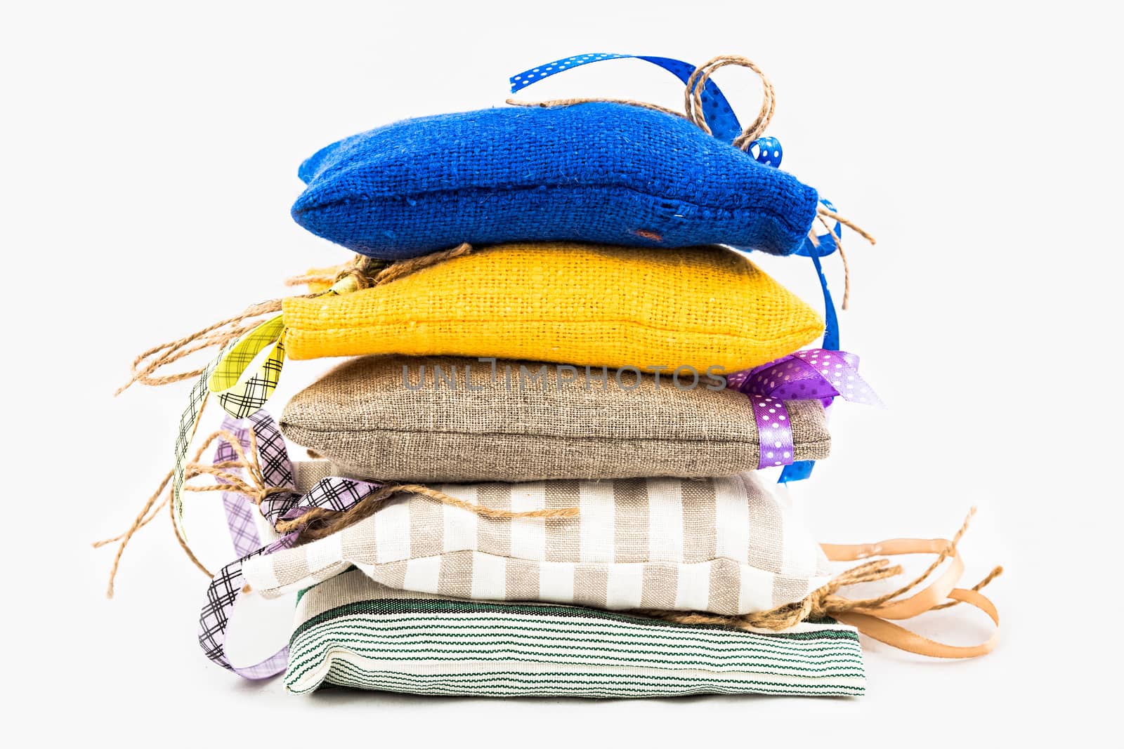 Decorative textile sachet pouches on white background