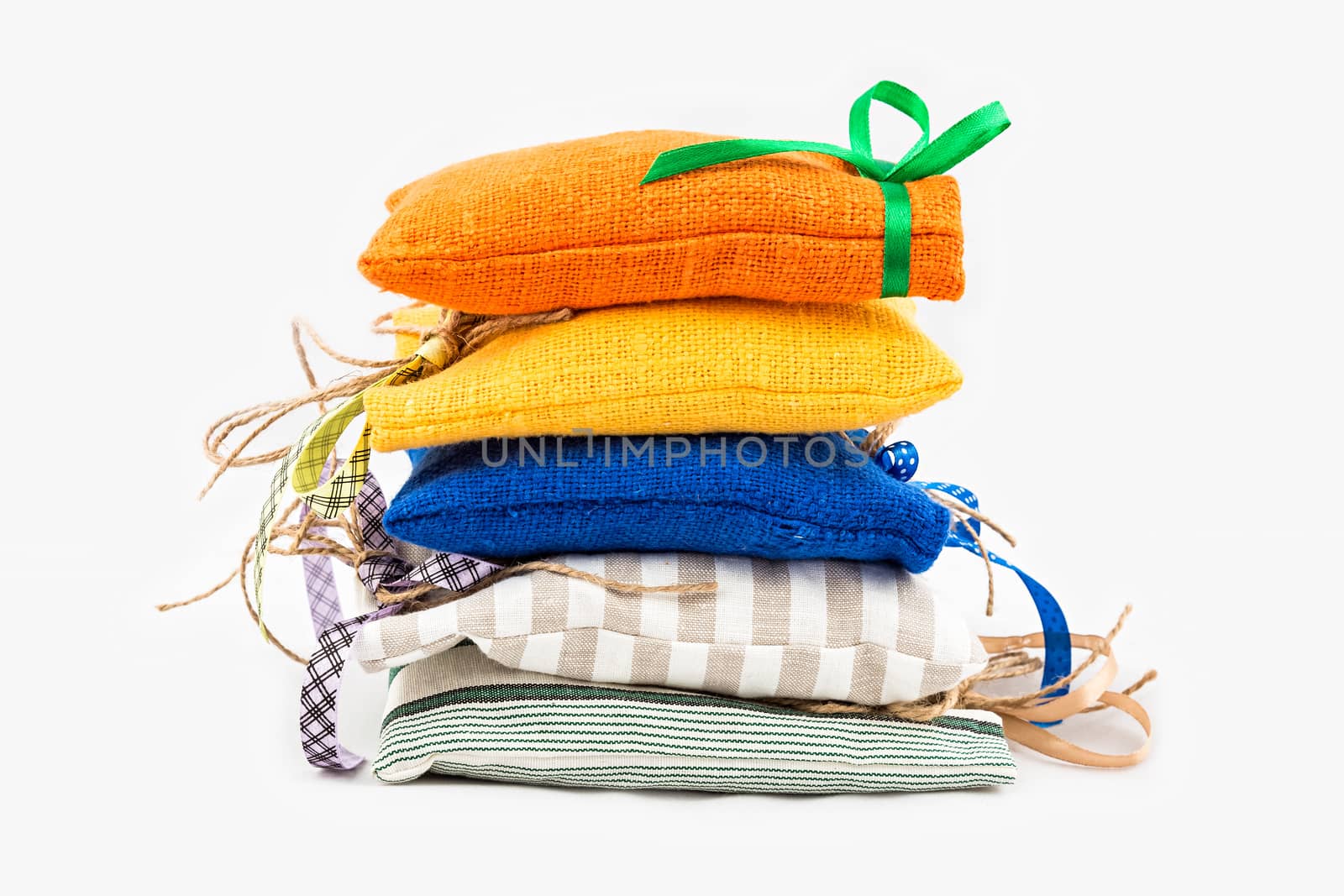 Decorative textile sachet pouches on white background