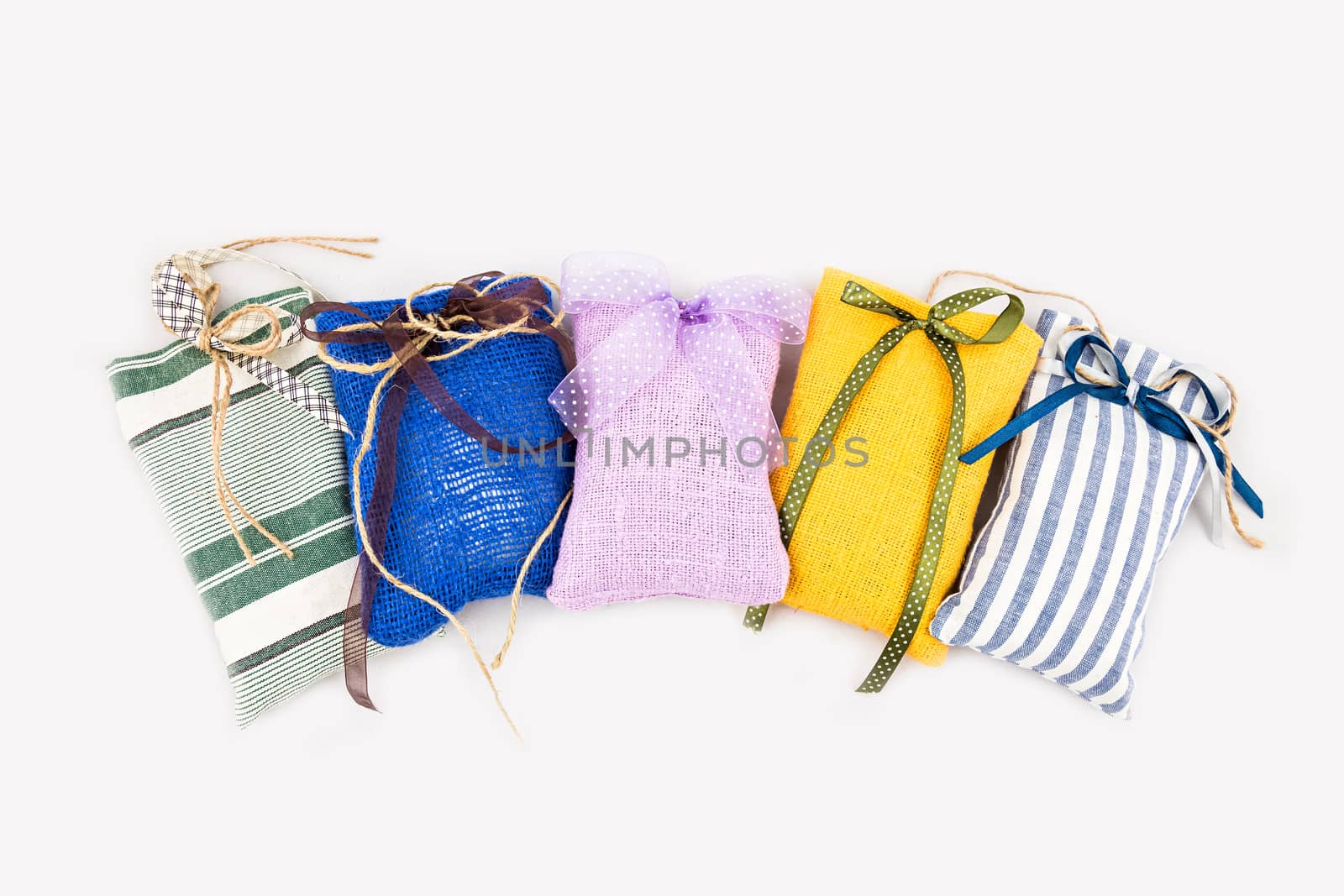 Decorative textile sachet pouches on white background