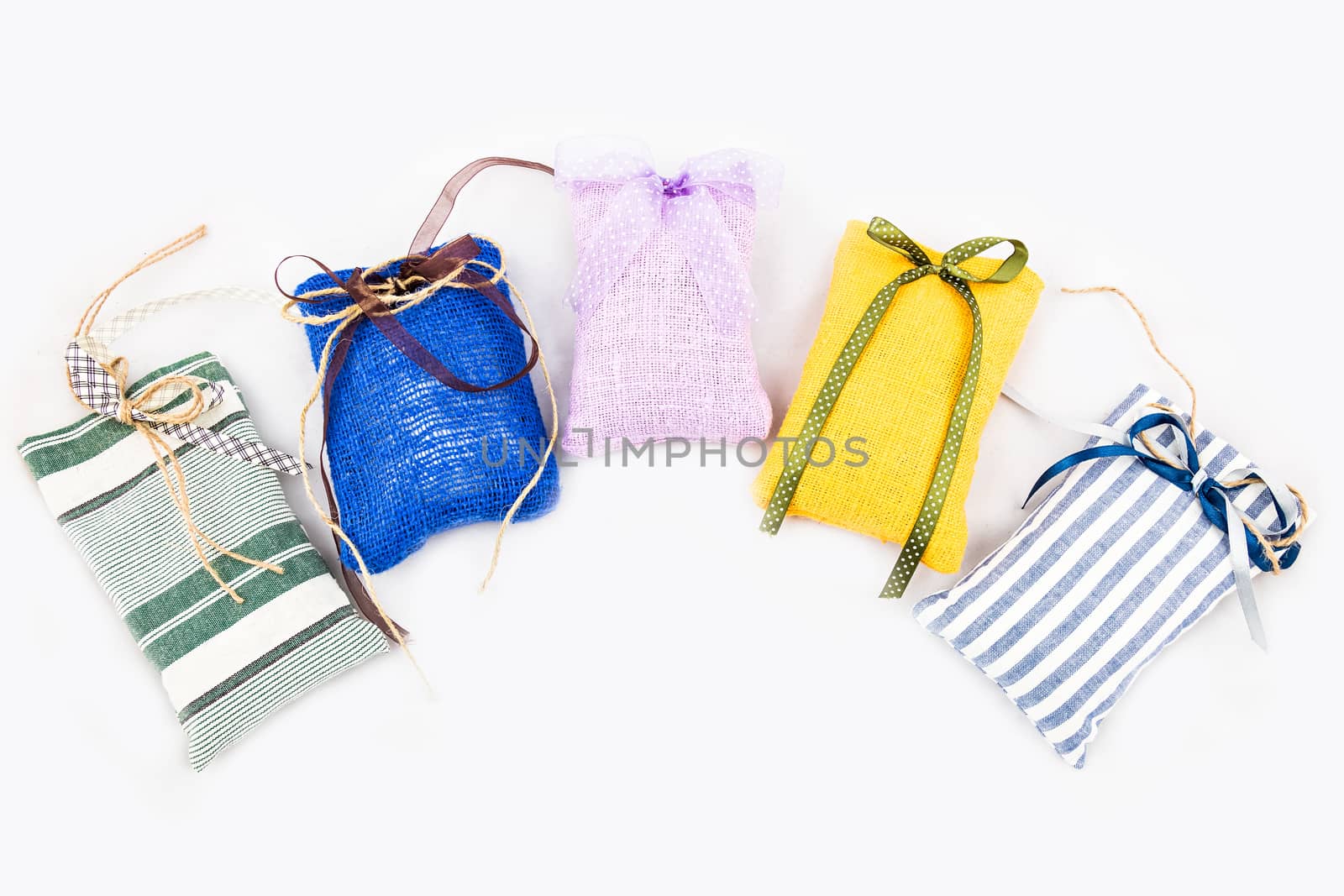 Decorative textile sachet pouches on white background