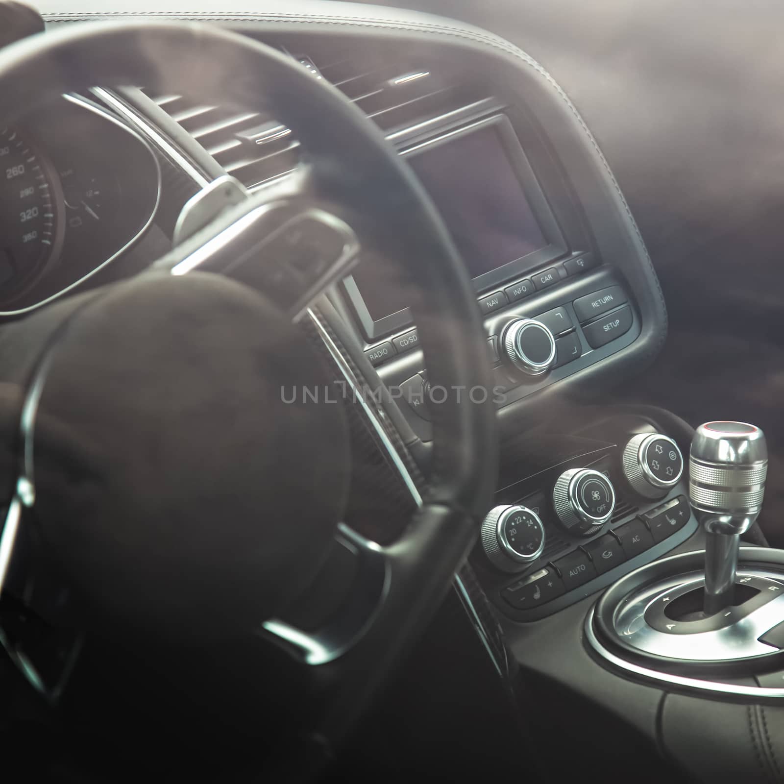 Steering wheel in interior of the sports car