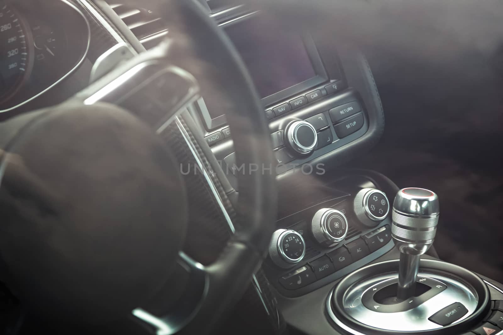 Steering wheel and dashboard in interior of the sports car