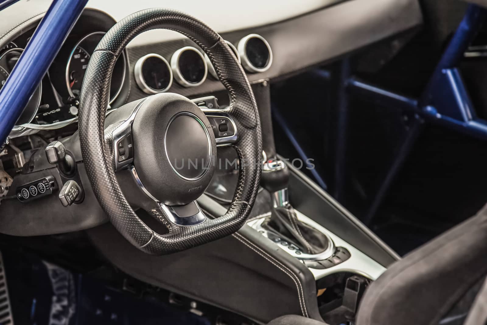Steering wheel in interior of the sports car