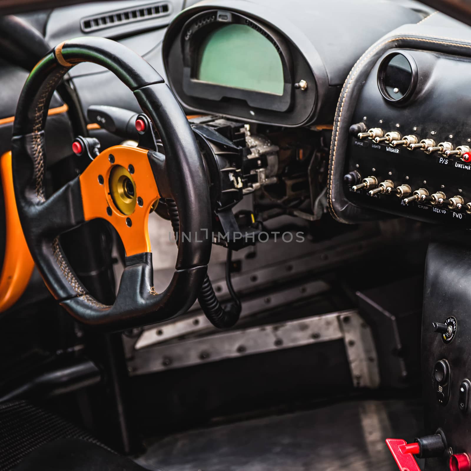Steering wheel and dashboard in interior of the sports car