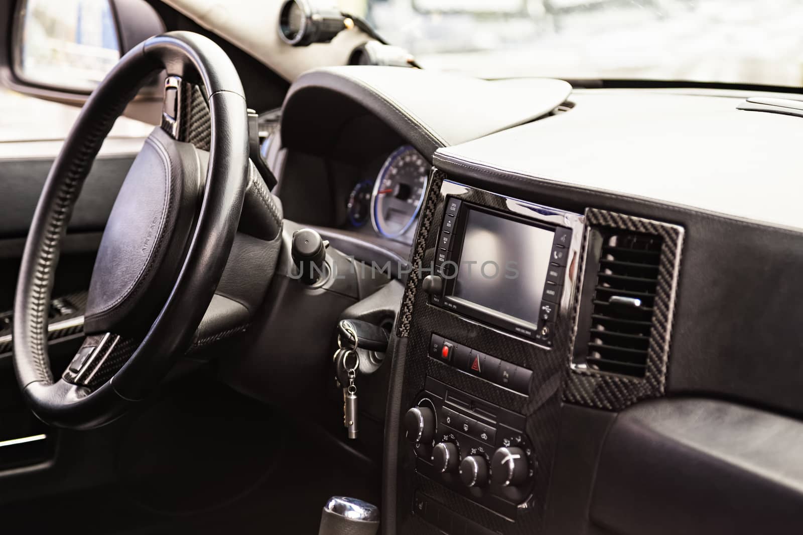 Steering wheel and dashboard in interior of the sports car