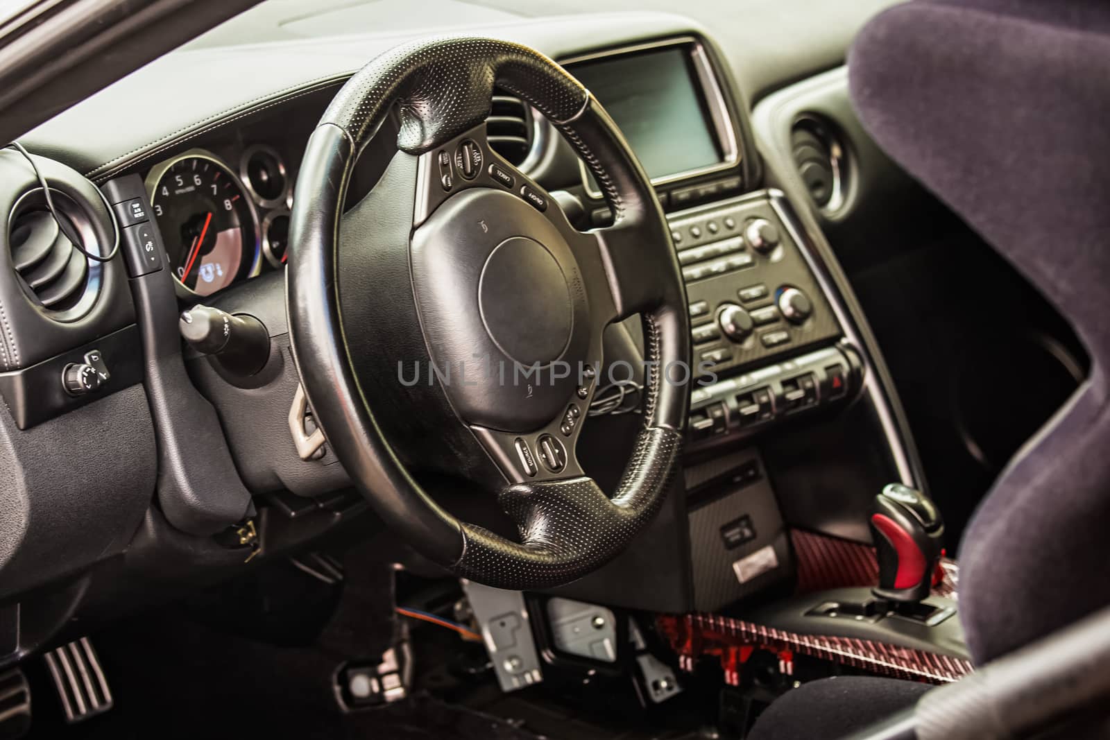 Steering wheel and dashboard in interior of the sports car