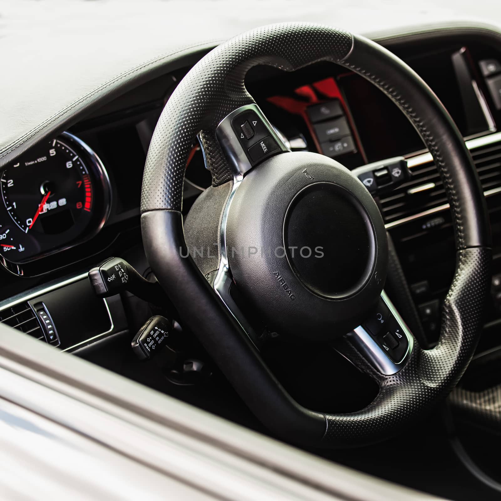 Steering wheel in interior of the sports car