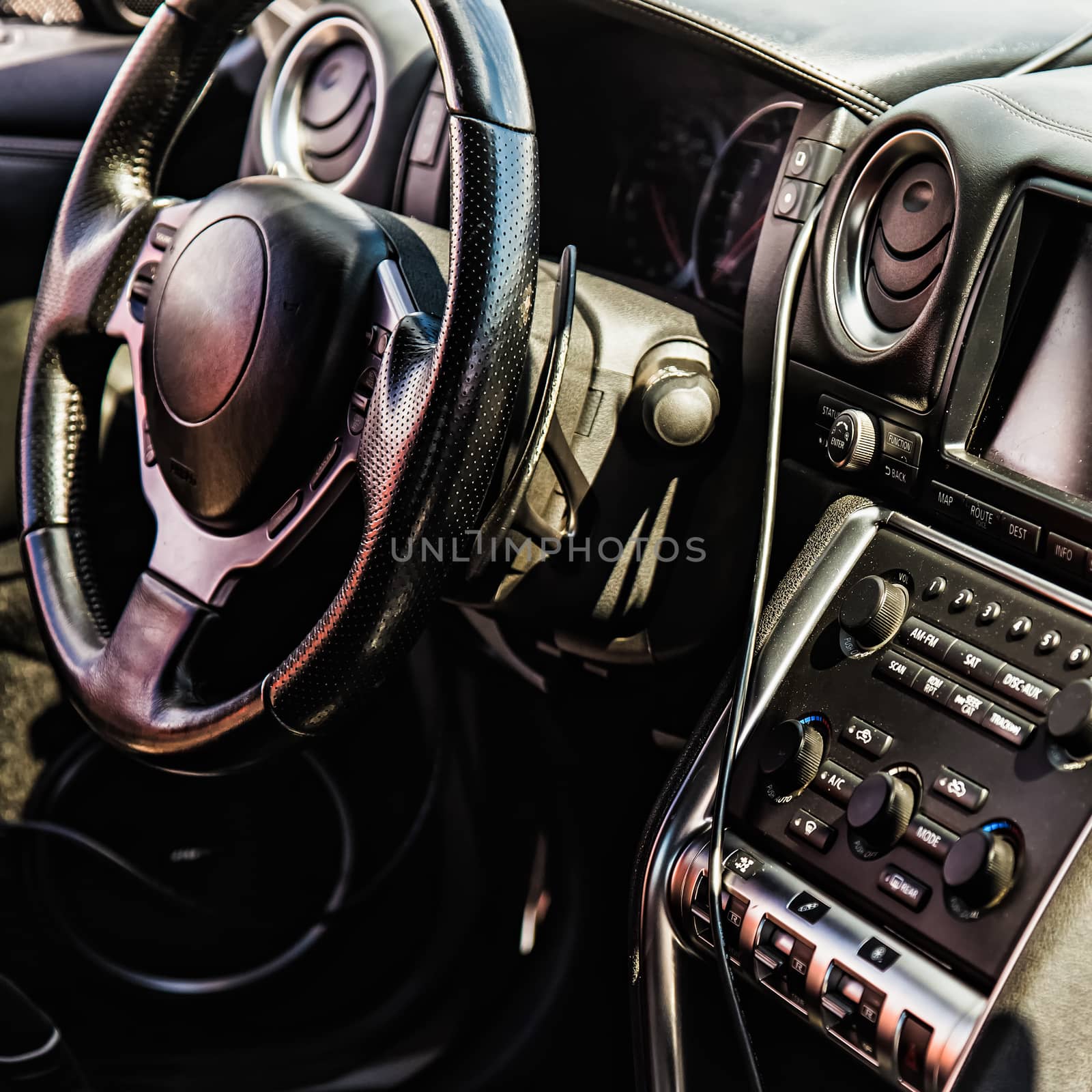 Steering wheel and dashboard in interior of the sports car