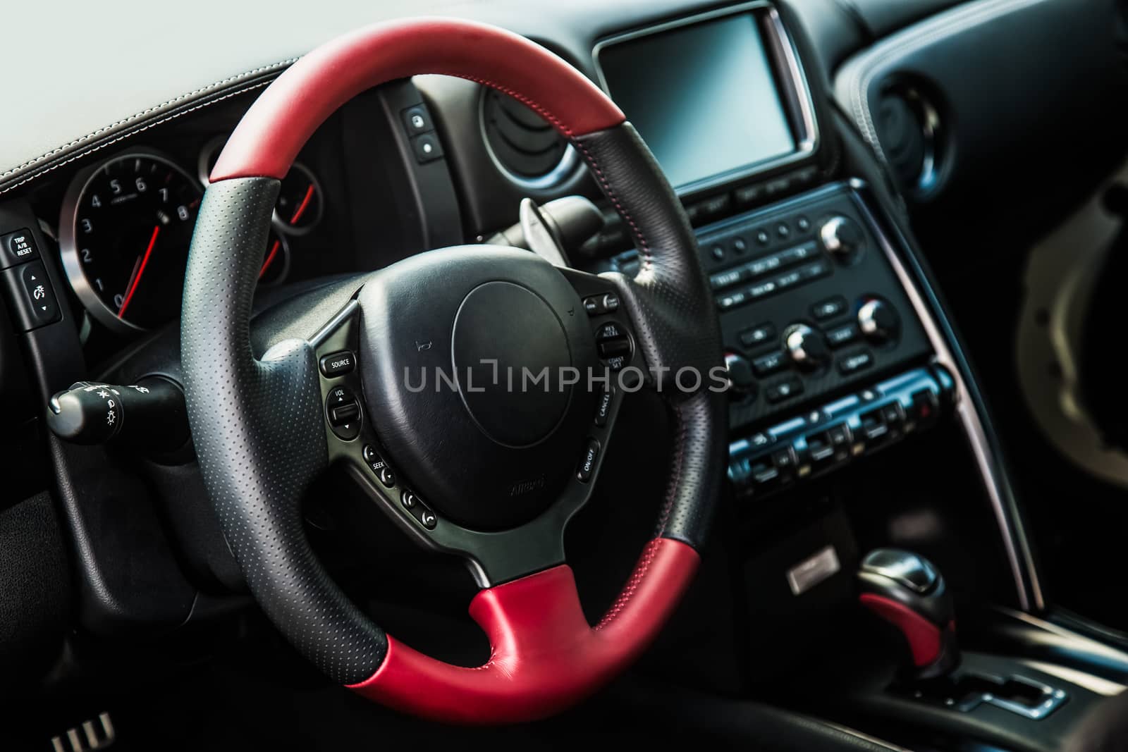 Steering wheel and dashboard in interior of the sports car