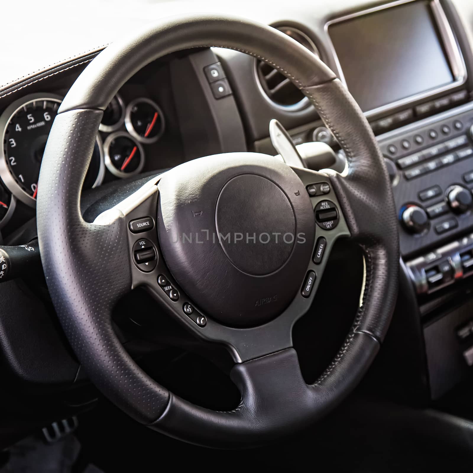 Steering wheel in interior of the sports car