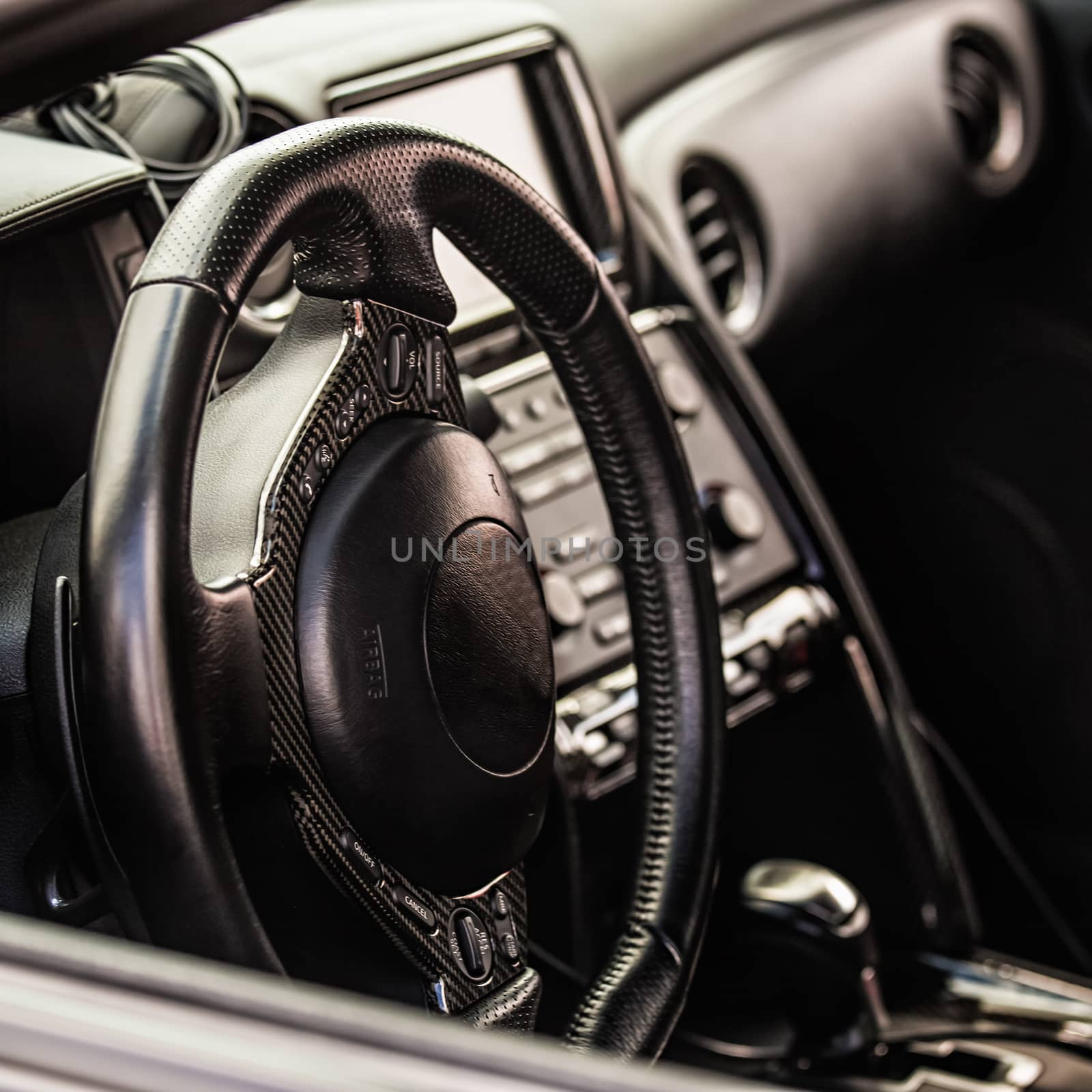 Steering wheel in interior of the sports car