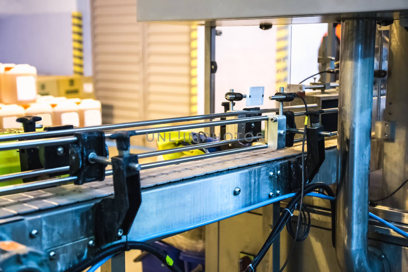 Automatic packing line of conveyor. Pharmaceutical and chemical industry. Manufacture on factory