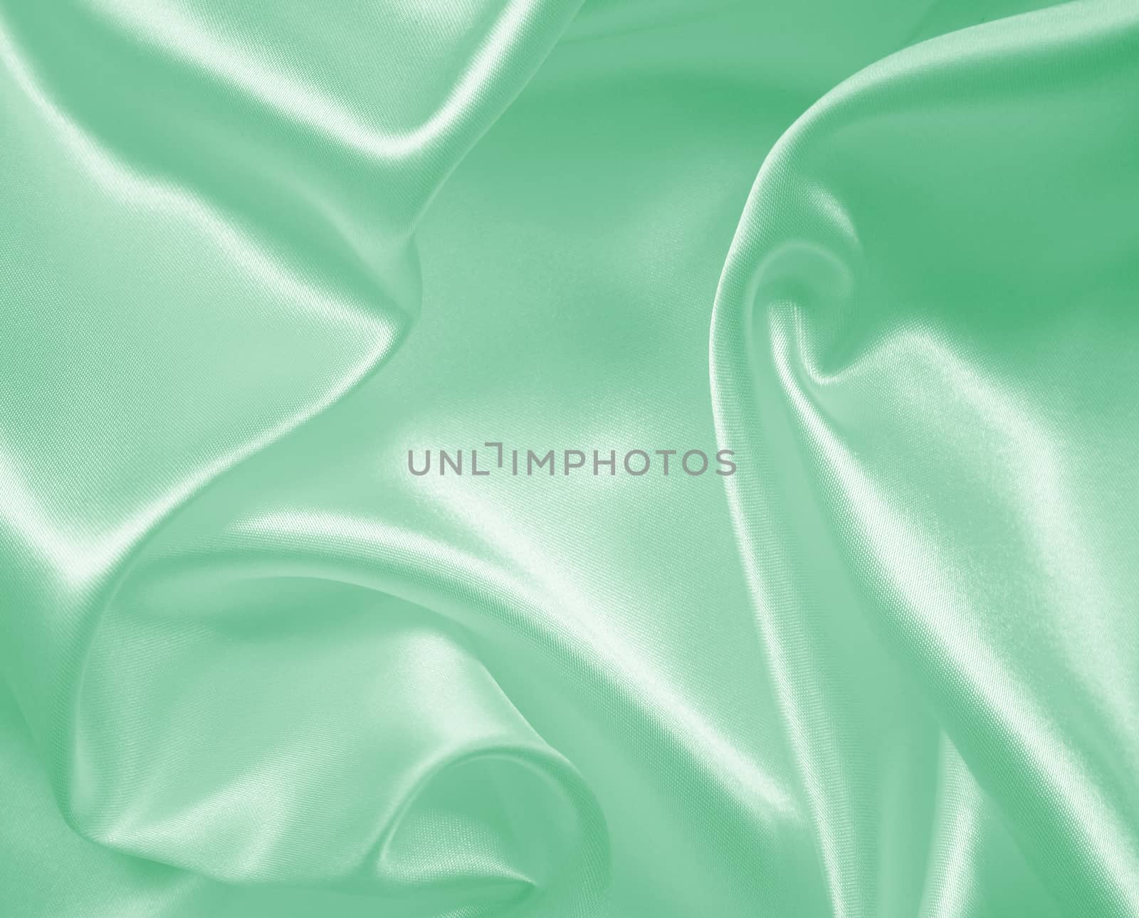 Smooth elegant green silk or satin texture as background  by oxanatravel